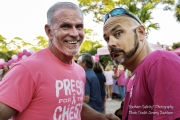 Two men having fun at the Pink Out smiling
