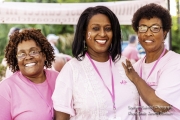 Three women smiling at the Pink Out event