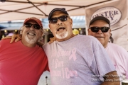 3 men smiling for the photo at Pink out